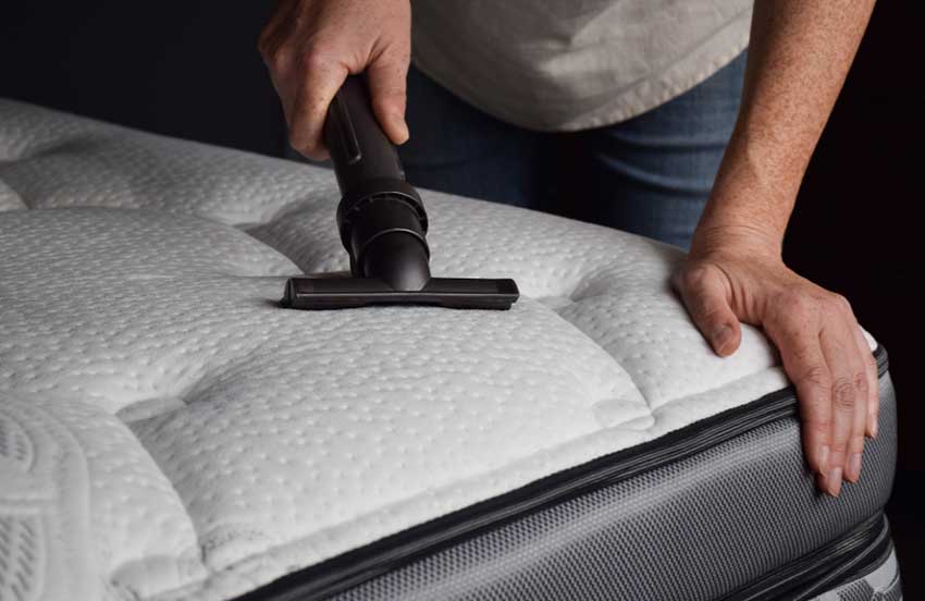 Vacuuming a mattress