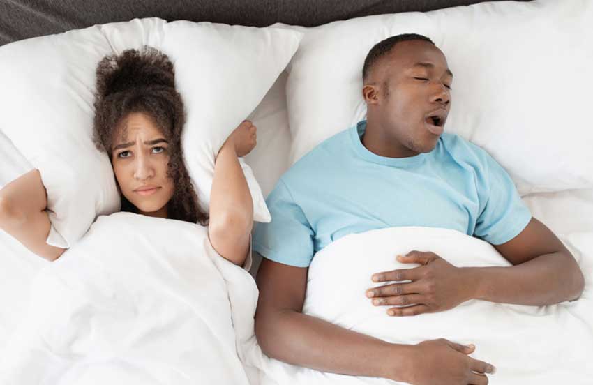 Woman can't sleep with husband snoring in bed