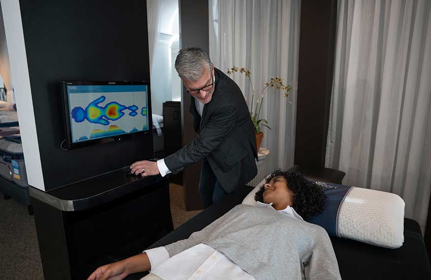 Woman testing out the ZEEZ machine